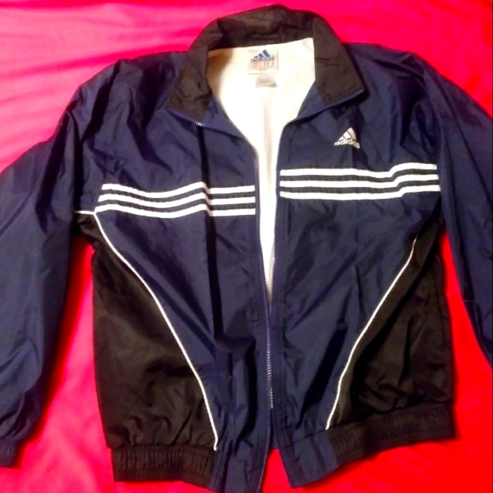 Adidas windbreaker. Small blue on black lightweight jacket. Great condition.